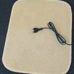 Electrisch verwarmde voetenmat